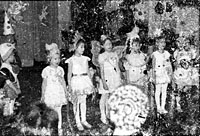 Found photograph, little girls dressing like butterflies singing for Christmas